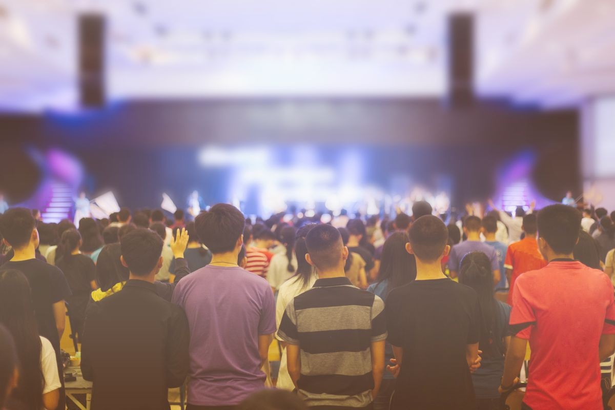Christian worship with raised hand at church,music concert